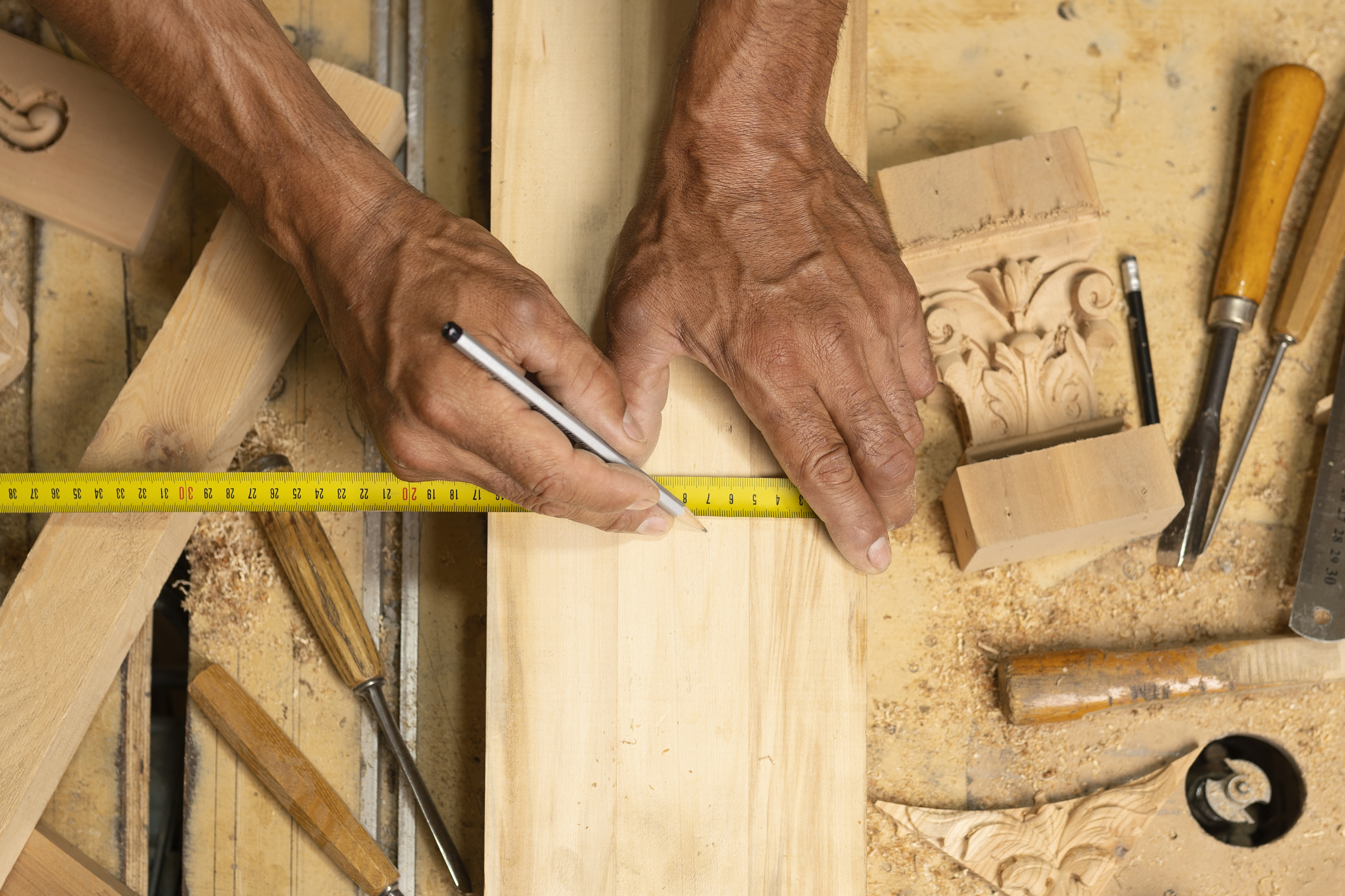 Architectural millwork interior with a shop drawing overlaid across the cabinetry run